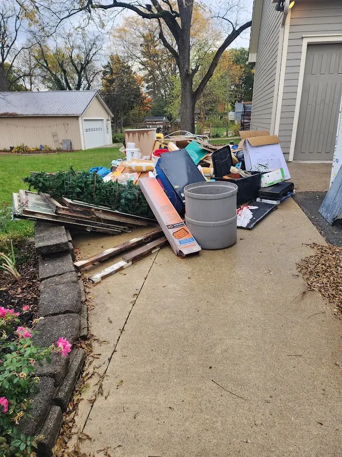 Dumpster being loaded with debris for 3 Yard Dumpster Rental in Benton Park